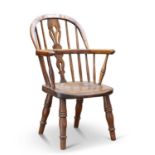 A 19TH CENTURY ELM AND OAK CHILD'S WINDSOR CHAIR