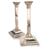 A PAIR OF ELIZABETH II SILVER COLUMNAR CANDLESTICKS