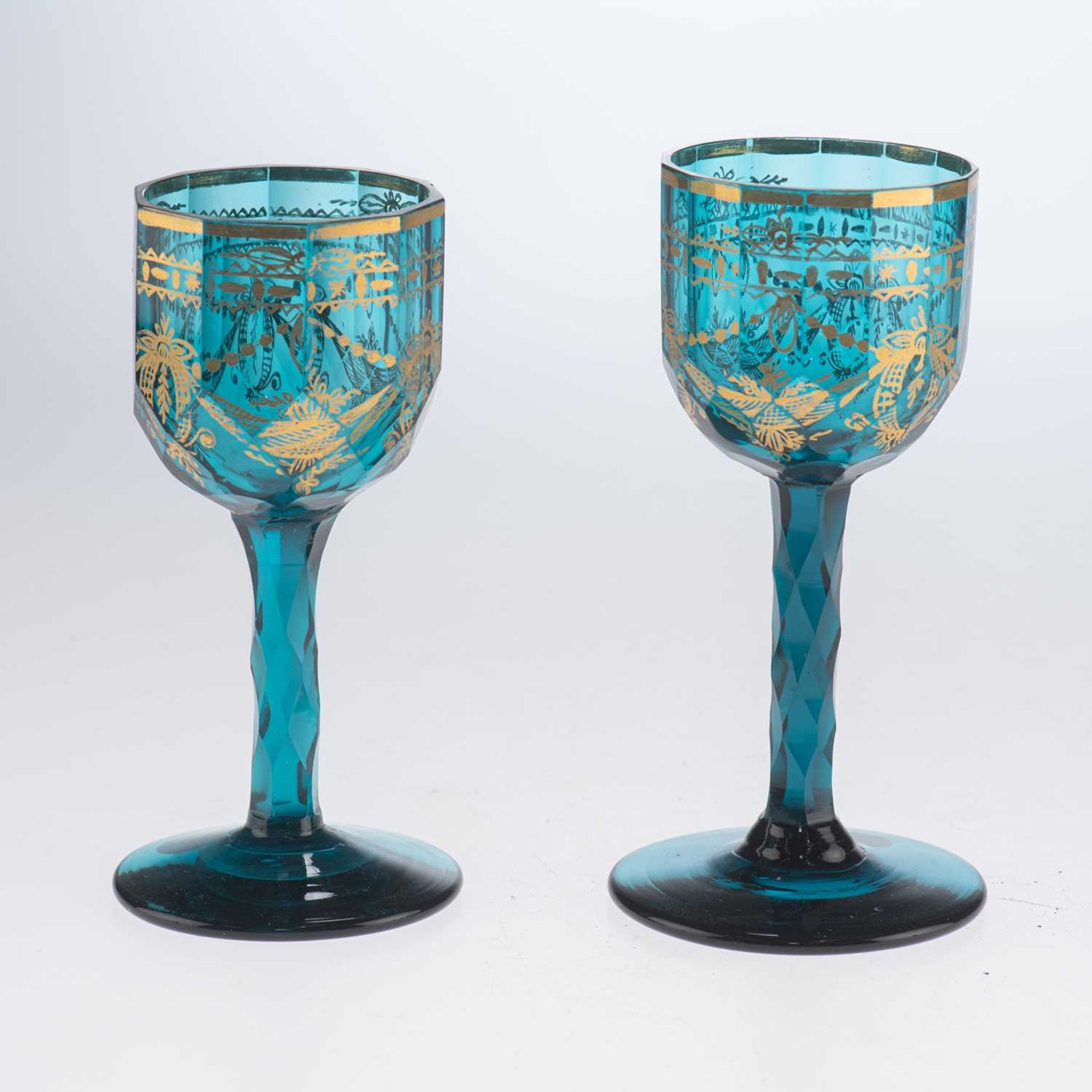 A NEAR PAIR OF GILDED TURQUOISE BLUE WINE GLASSES, 18TH CENTURY