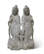 A CHINESE CARVED STONE FIGURE GROUP