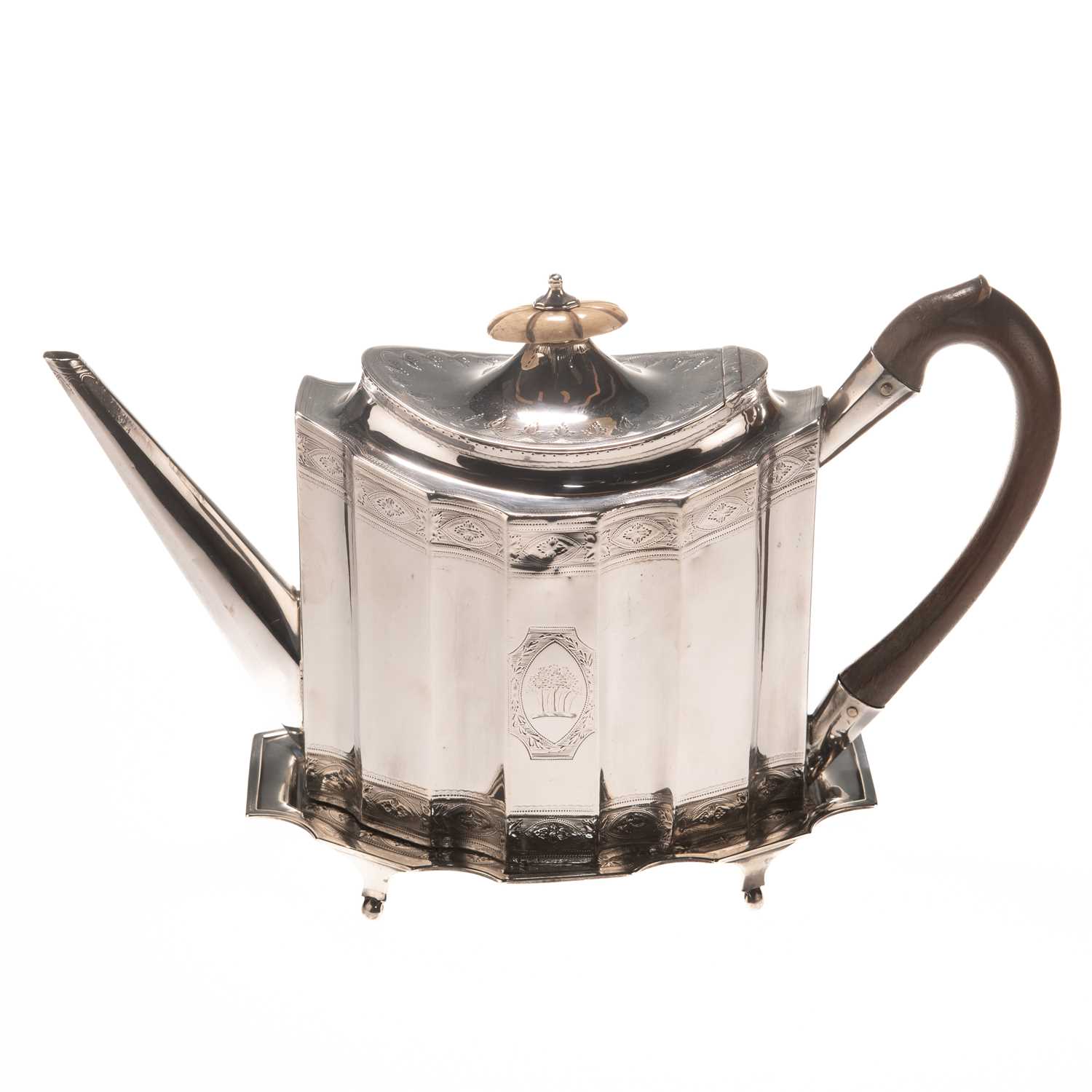 A GEORGE III SILVER TEAPOT ON STAND