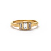 AN 18CT YELLOW GOLD AND DIAMOND THREE STONE RING