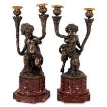 A PAIR OF LOUIS XVI STYLE GILT, PATINATED BRONZE AND MARBLE TWO-LIGHT CANDELABRA after Clodion, four