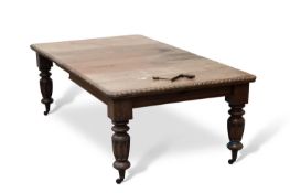 A 19TH CENTURY OAK WIND-OUT EXTENDING DINING TABLE