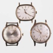 A TRIO OF 9CT GOLD WATCH HEADS