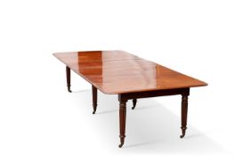 A REGENCY MAHOGANY PULL-OUT DINING TABLE, IN THE MANNER OF GILLOWS
