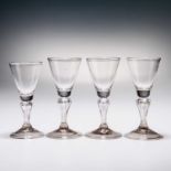 FOUR 18TH CENTURY MOULDED-STEM WINE GLASSES