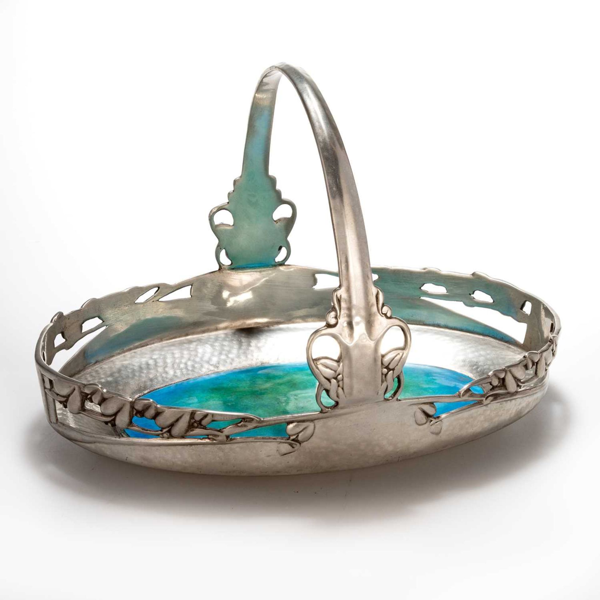 ARCHIBALD KNOX (1864-1933) FOR LIBERTY & CO, A TUDRIC PEWTER AND ENAMEL CAKE BASKET