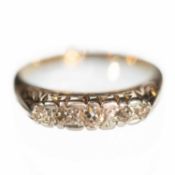 AN 18CT YELLOW GOLD AND DIAMOND FIVE STONE RING