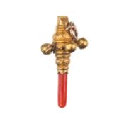 A 19TH CENTURY MINIATURE CORAL AND GOLD RATTLE CHARM