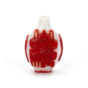 A PEKING WHITE GLASS SNUFF BOTTLE WITH RED OVERLAY, 19TH CENTURY