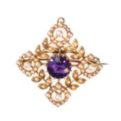 AN EDWARDIAN 15 CARAT YELLOW GOLD AMETHYST AND SEED PEARL BROOCH/ PENDANT