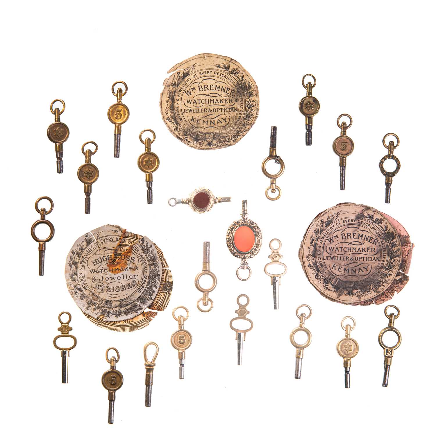 AN ASSORTMENT OF POCKET WATCH KEYS AND PAPERS