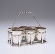 A SET OF SIX FRENCH IMPORT SILVER TOT CUPS IN A WIRE STAND