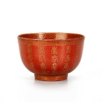 A CHINESE CORAL RED-GROUND GILT-DECORATED BOWL