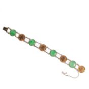 A CHINESE YELLOW GOLD AND JADE BRACELET