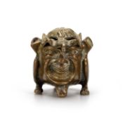 A BRASS INKWELL IN THE FORM OF A GROTESQUE DEVIL OR IMP, CIRCA 1890-1900