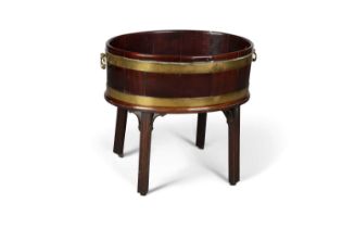 A GEORGE III BRASS-BOUND COOPERED MAHOGANY WINE COOLER ON STAND