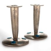 A PAIR OF LIBERTY & CO TUDRIC PEWTER AND ENAMEL CANDLESTICKS