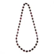 A 19TH CENTURY YELLOW GOLD AND GARNET NECKLACE