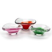 VICKE LINDSTRAND FOR KOSTA, THREE FREE-FORM COLOURED AND CLEAR GLASS BOWLS, CIRCA 1950S