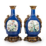 A PAIR OF ORMOLU-MOUNTED POWDER-BLUE-GROUND AND FAMILLE VERTE BOTTLE VASES