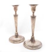 A PAIR OF GEORGE III NEOCLASSICAL SILVER CANDLESTICKS