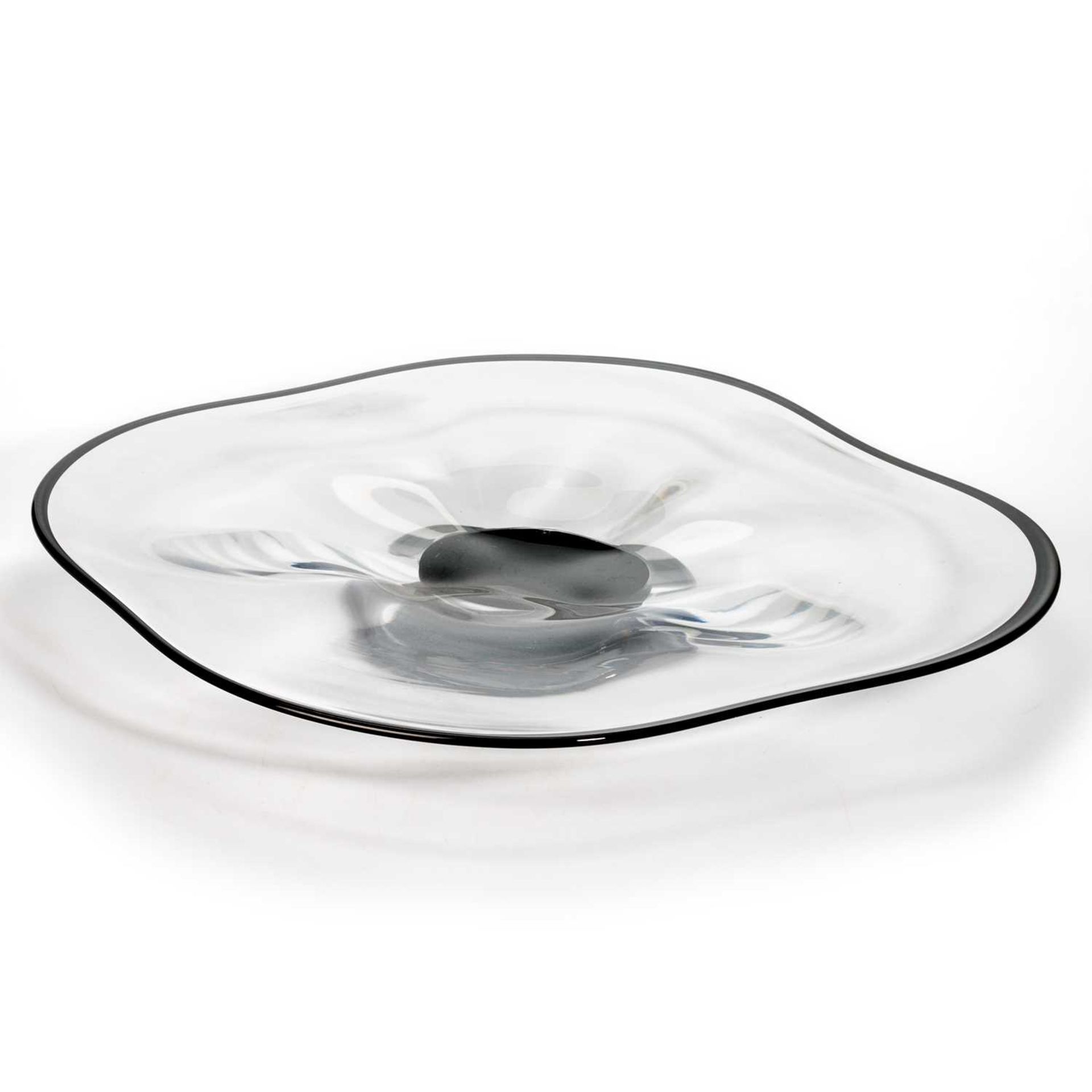 SIMON GATE FOR ORREFORS, A CLEAR GLASS DISH WITH BACK RIM AND FOOT, CIRCA 1930S