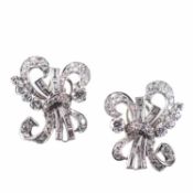 A PAIR OF PLATINUM AND DIAMOND EARRINGS