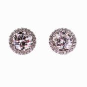 A PAIR OF 18 CARAT WHITE GOLD AND DIAMOND STUD EARRINGS