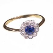 AN EDWARDIAN SAPPHIRE AND DIAMOND FLOWER HEAD CLUSTER RING