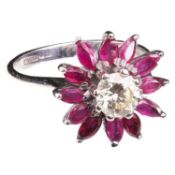 AN 18 CARAT WHITE GOLD, DIAMOND AND RUBY FLOWER HEAD CLUSTER RING