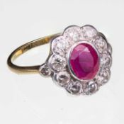 AN EDWARDIAN STYLE RUBY AND DIAMOND CLUSTER RING