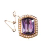 A 19TH CENTURY AMETHYST AND PEARL BROOCH