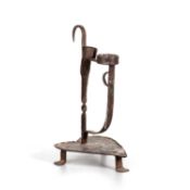 AN 18TH CENTURY IRON CANDLE HOLDER