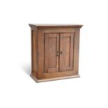 AN EARLY 19TH CENTURY OAK SPICE CUPBOARD