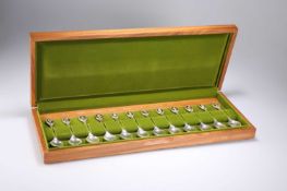 A SET OF TWELVE ELIZABETH II SILVER THE ROYAL HORTICULTURAL SOCIETY FLOWER SPOONS