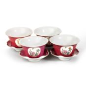 FOUR CHINESE FAMILLE ROSE 'MEDALLION' TEA BOWLS AND SAUCERS