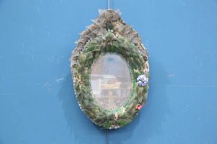 A 19TH CENTURY VENETIAN OVAL MIRROR