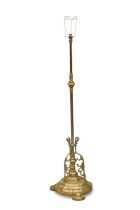 AN EDWARDIAN BRASS STANDARD LAMP