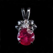 AN 18 CARAT WHITE GOLD RUBY AND DIAMOND PENDANT