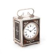 AN EDWARDIAN SILVER AND TORTOISESHELL CARRIAGE CLOCK