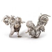 A PAIR OF GERMAN SILVER TABLE ORNAMENTS MODELLED AS A PAIR OF FIGHTING COCKERELS