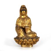 A TIBETO-CHINESE GILT-BRONZE FIGURE OF A BUDDHA, 18TH/ 19TH CENTURY