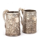 A NEAR PAIR OF CHINESE EXPORT SILVER TANKARDS