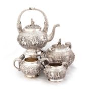 AN EARLY 20TH CENTURY ANGLO-INDIAN SILVER FOUR-PIECE TEA SERVICE