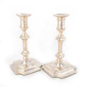 A PAIR OF GEORGIAN STYLE SILVER CANDLESTICKS