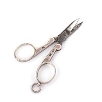 A PAIR OF VICTORIAN SILVER-HANDLED FOLDING SCISSORS