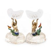 A RARE PAIR OF AUSTRIAN SILVER-GILT, ENAMEL AND ROCK CRYSTAL FIGURAL TAZZE