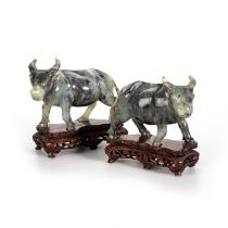 A PAIR OF CHINESE CARVED JADE MODELS OF WATER BUFFALO